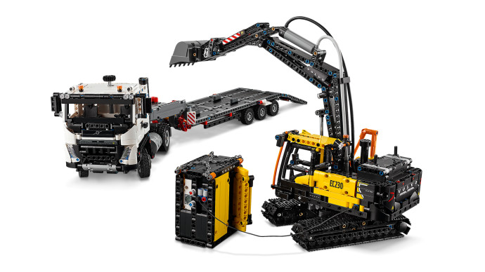 Nákladní auto Volvo FMX a elektrický bagr Volvo EC230